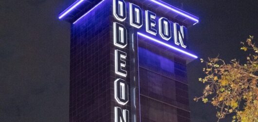 Odeon cinema tower illuminated at night